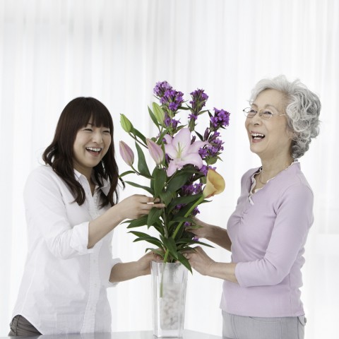 a Chinese Student Giving Flowers to Her Teacher