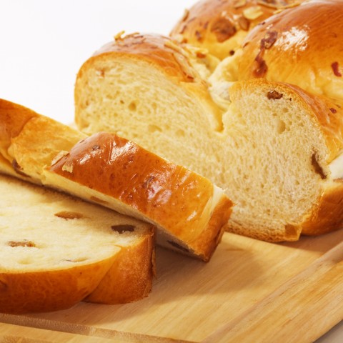 A Loaf of Vánočka being Sliced