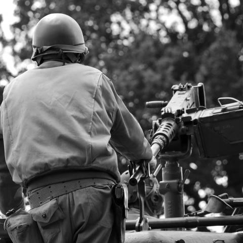 Black and White Image of Someone on a Tank