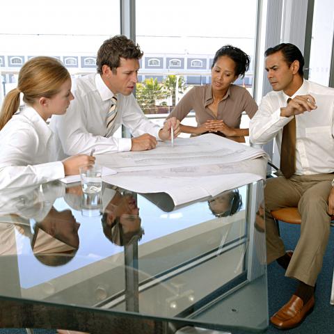 Business Professionals Busy in a Meeting