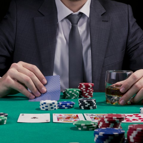 A Man Gambling in a Casino