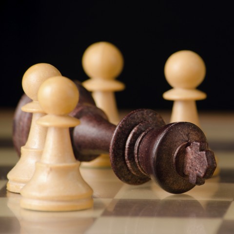 A Fallen King on a Chessboard, Signifying a Lost Game