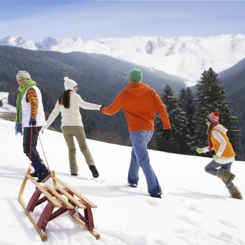 A Family Doing Snow Activities During Winter Vacation