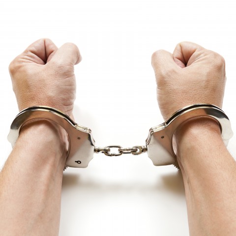 Male Hands in Handcuffs
