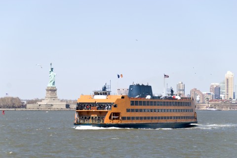 A Ferry Boat Going to Ellis Island, with the Statue of Liberty in the Background