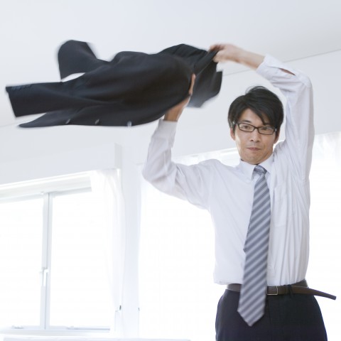 A Japanese Businessman Getting Ready to Leave for Work