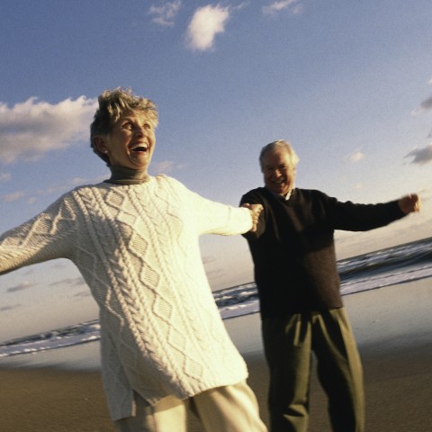 Old Couple Playing on the Beach