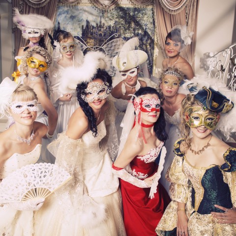 Several People Dressed in Masquerade Costumes