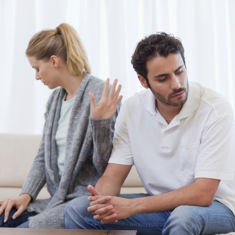 A Woman Rejecting a Man Using a Hand Gesture 