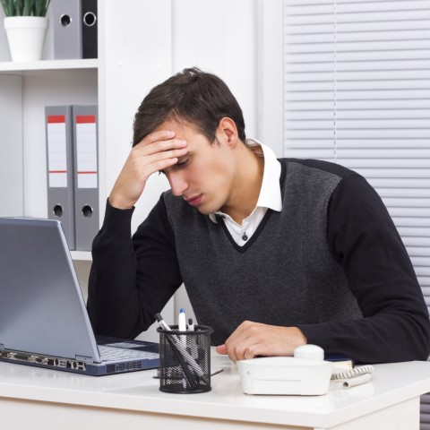 A Man Frustrated with His Computer Work