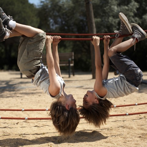 Two Kids Playing on a Playground