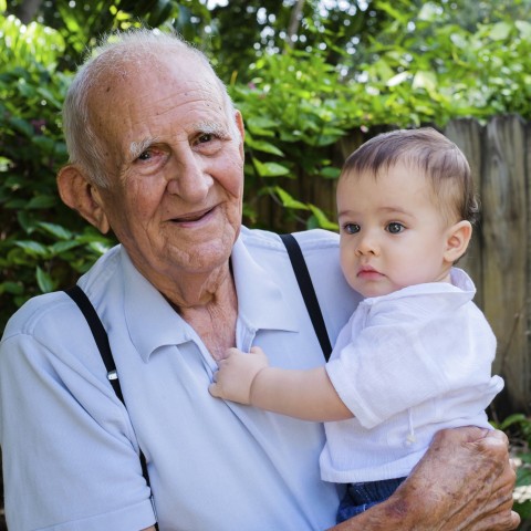 A Grandfather Holding His Grandchild