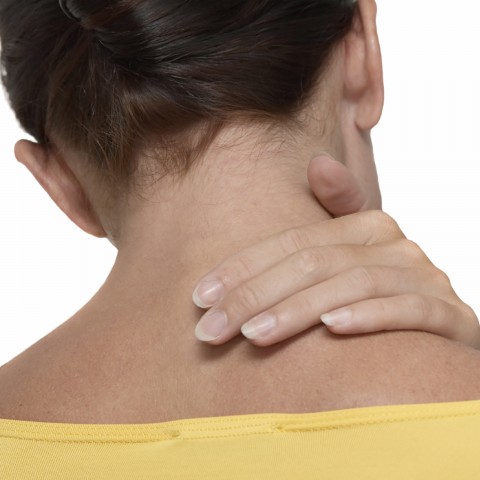 A Woman Rubbing Her Neck