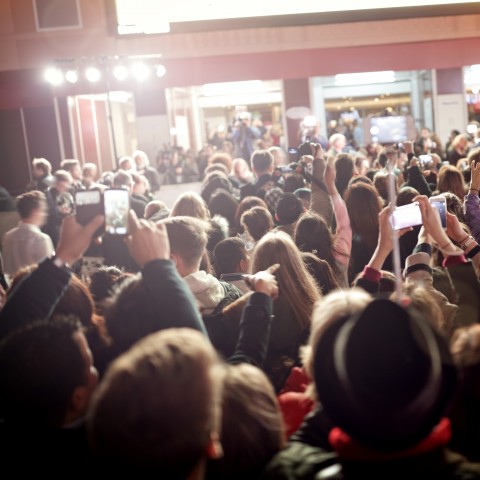 A Crowd Cheering and Taking Photos