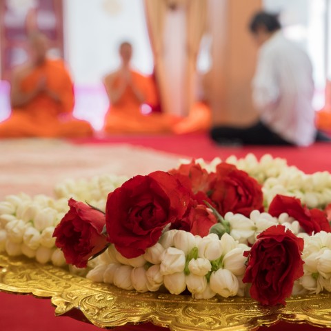 Buddhist Monks Praying and Making Merit