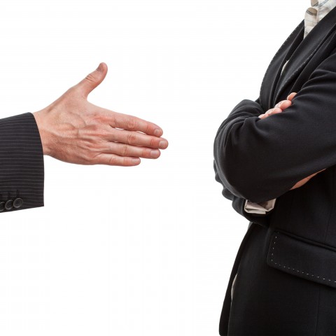 A Person Offering His Hand for a Handshake, with the Other Person not Reciprocating