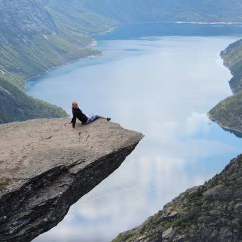 Man Chilling on Mountain Ledge