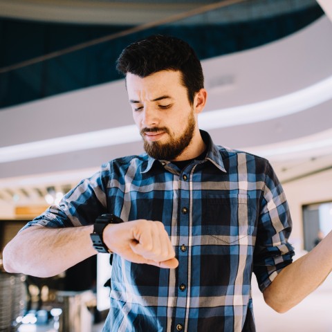 A Man Looking at His Watch