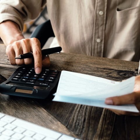 Man Calculating on Something