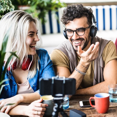 A Couple Laughing at a Table