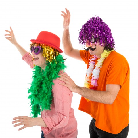 A Man and Woman Dancing while Wearing Silly Costumes