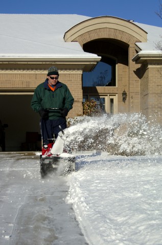 Someone Clearing Snow from Their Driveway