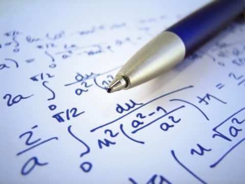 Complicated Algebra Equations Written in Blue Pen