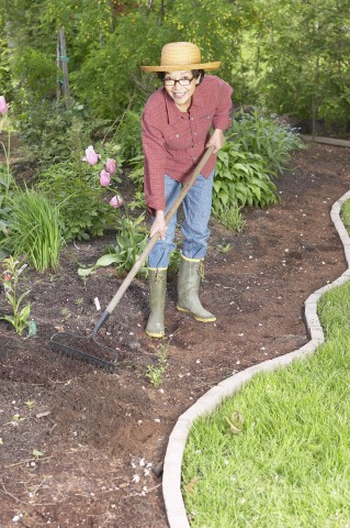 A Woman Cultivating Her Garden