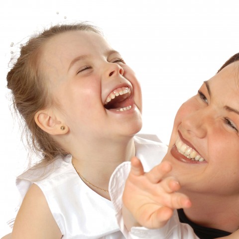 A Mother and Her Young Daughter Laughing