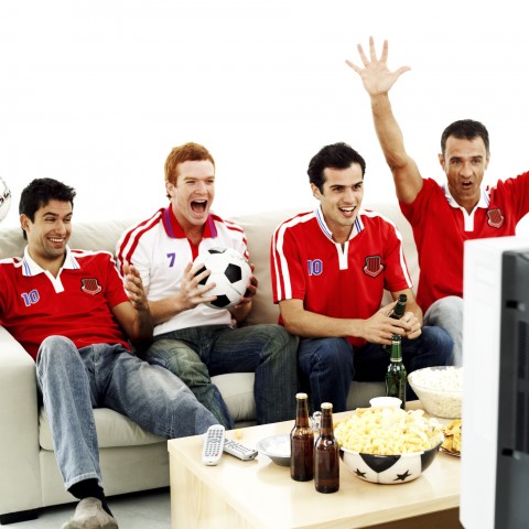 Group of Guys Watching a Soccer Game on TV