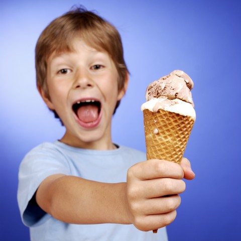 A Child Holding an Ice Cream