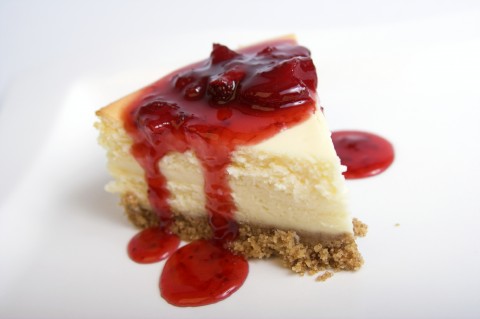 A Cheesecake Slice with Strawberry Topping