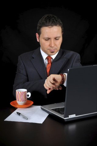 A Business Professional Looking at the Wristwatch