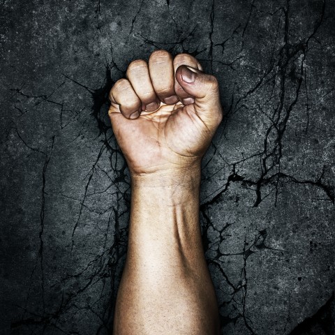 A Fist Against a Dark Background