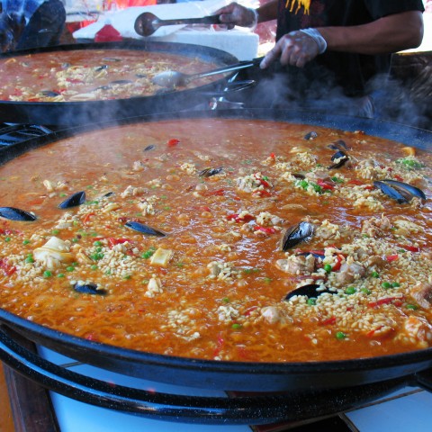 Someone Cooking Large Batches of Paella