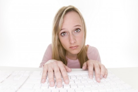 A Woman Performing Tedious Work at Her Keyboard