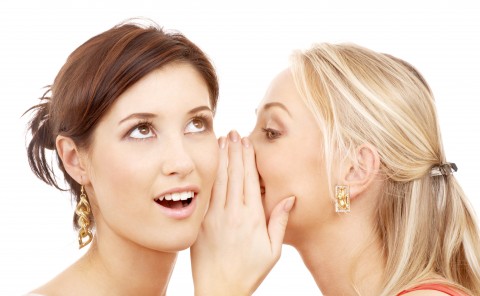 One Woman Whispering in Another Woman’s Ear