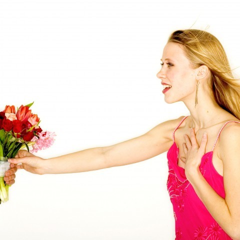 Someone Offering Flowers to a Woman