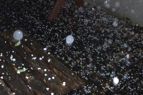 Large Hailstones on a Wooden Floor