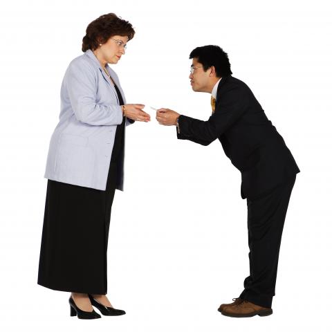 Man Giving Woman a Business Card