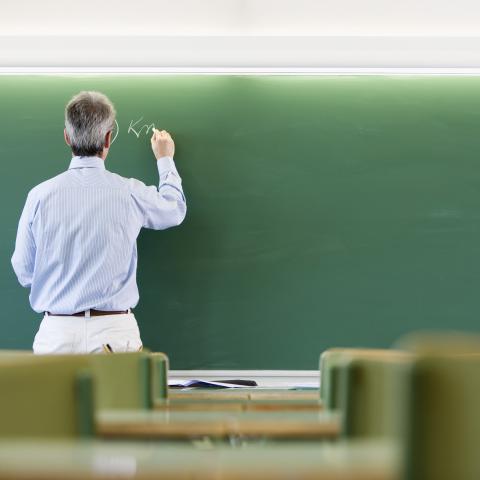 Teacher Writing on Board