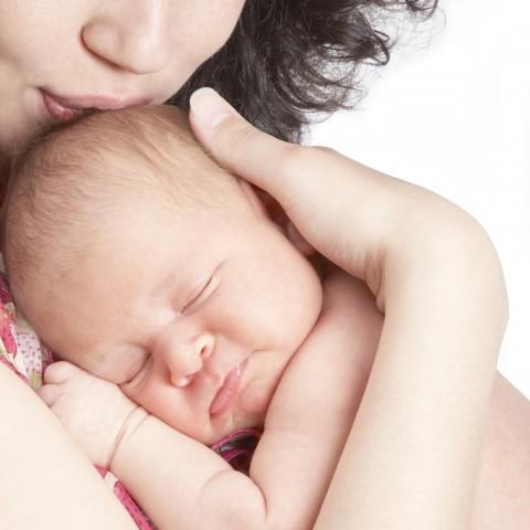 A Sleeping Baby in Its Mother's Arms.