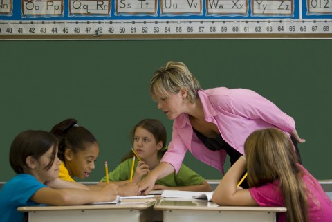 A Teacher Giving Instructions to a Group of Young Students