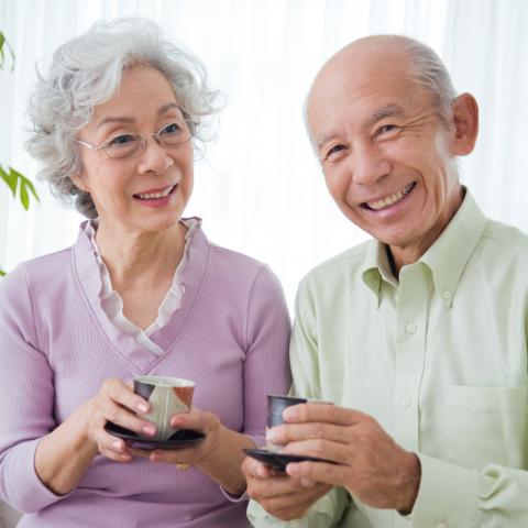 Old Japanese Couple Drinking Tea Together.