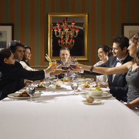 People Toasting at a Large Dinner