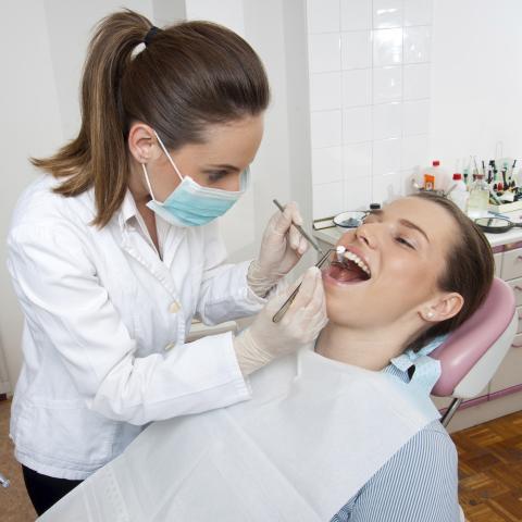 Dentist Checking Someone’s Mouth