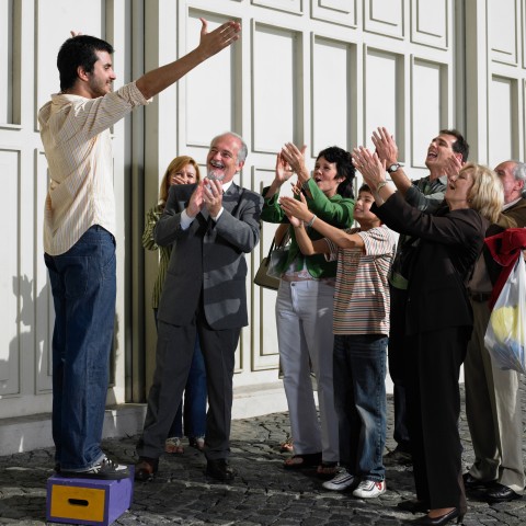 A Crowd Cheering on an Orator