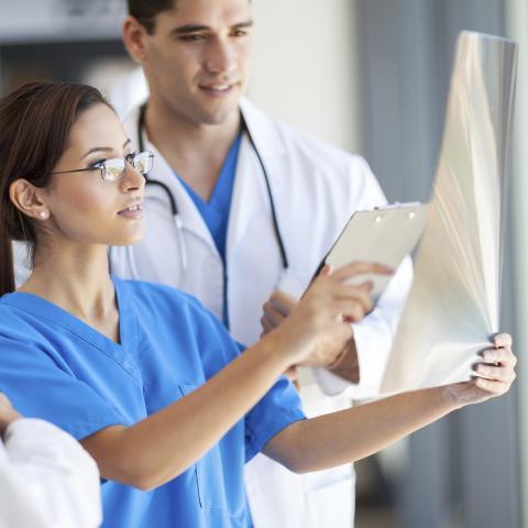 Two Medical Professionals Looking Over a Chart Together