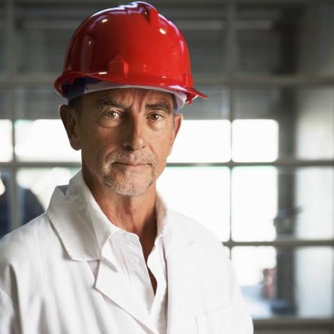 An Engineer Wearing a Red Helmet