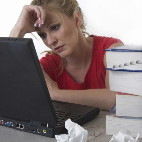 A Woman Tired and Stressed about Work and School